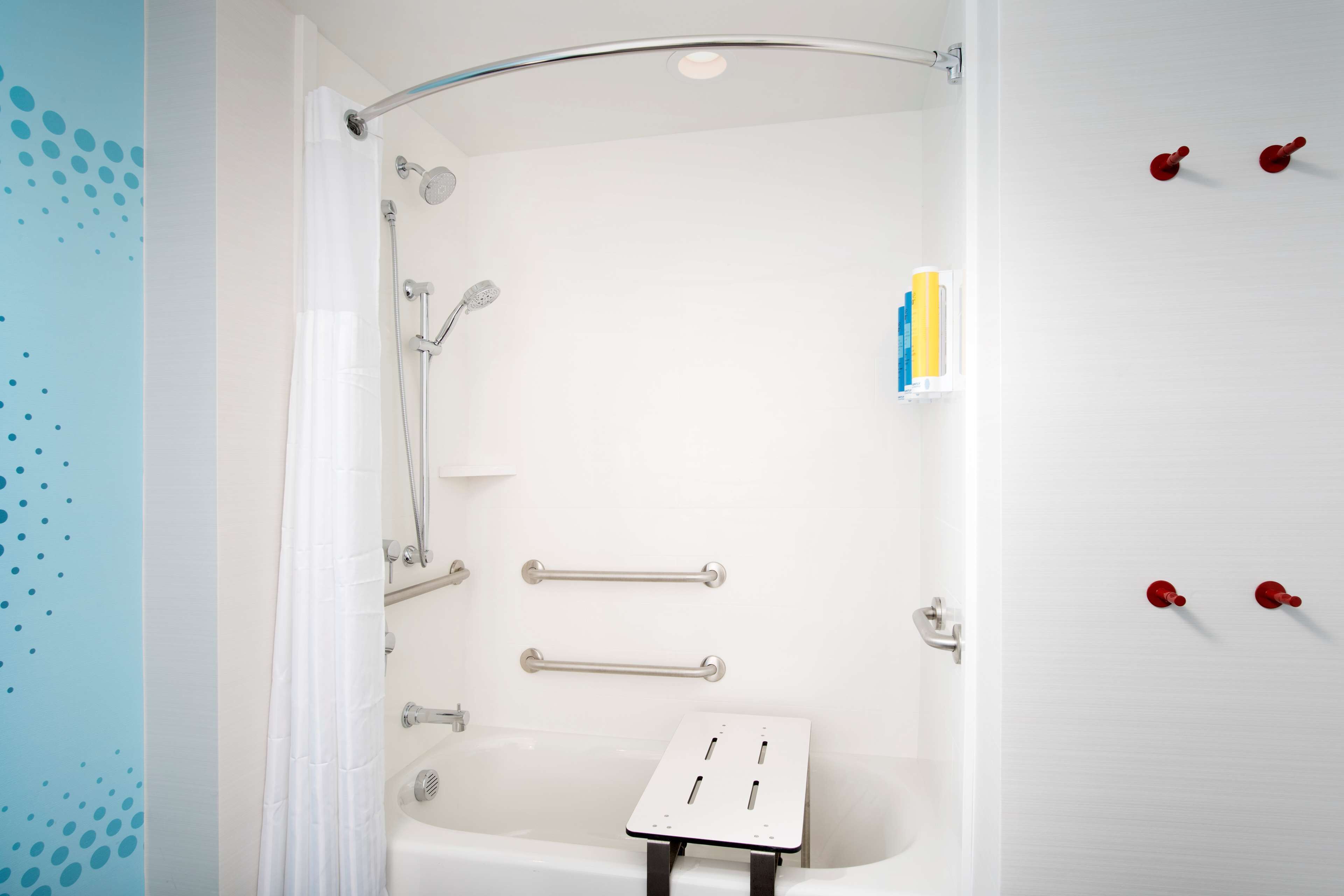 designer toiletries, hair dryer, towels