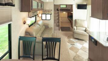 RV Rental (Linens Not Provided) | Living area | Flat-screen TV