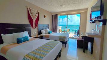 Habitación Premium, Vista al Mar | Cofres nos quartos, escrivaninha, roupa de cama