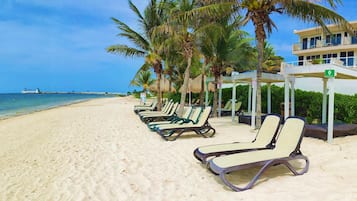 On the beach, sun loungers