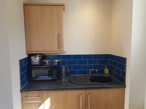 Apartment, 1 Bedroom | Private kitchen | Fridge, electric kettle