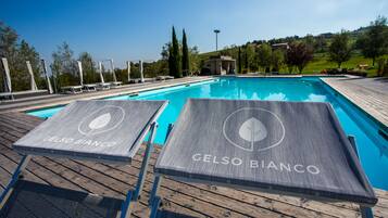 Seasonal outdoor pool, open 9:00 AM to 7:00 PM, sun loungers
