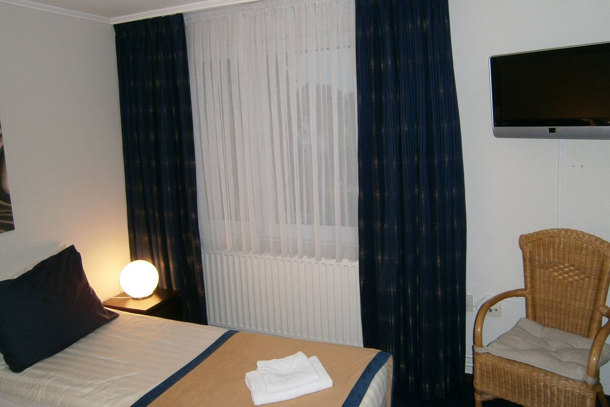 Desk, blackout curtains, free WiFi, bed sheets