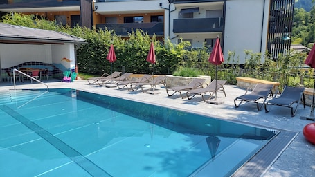 Seasonal outdoor pool, pool umbrellas, sun loungers