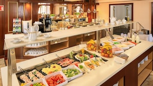 A buffet with various food items and a coffee station. - Hotel Bellevue Vienna (Vienna)