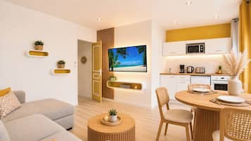 Una sala moderna con un sofá, una mesita de centro y un televisor montado en una pared de madera.
