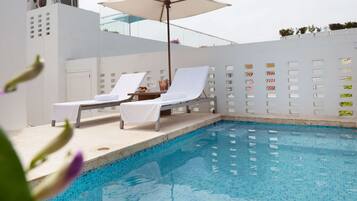 Outdoor pool, open 8:00 AM to 7:00 PM, free cabanas, pool umbrellas