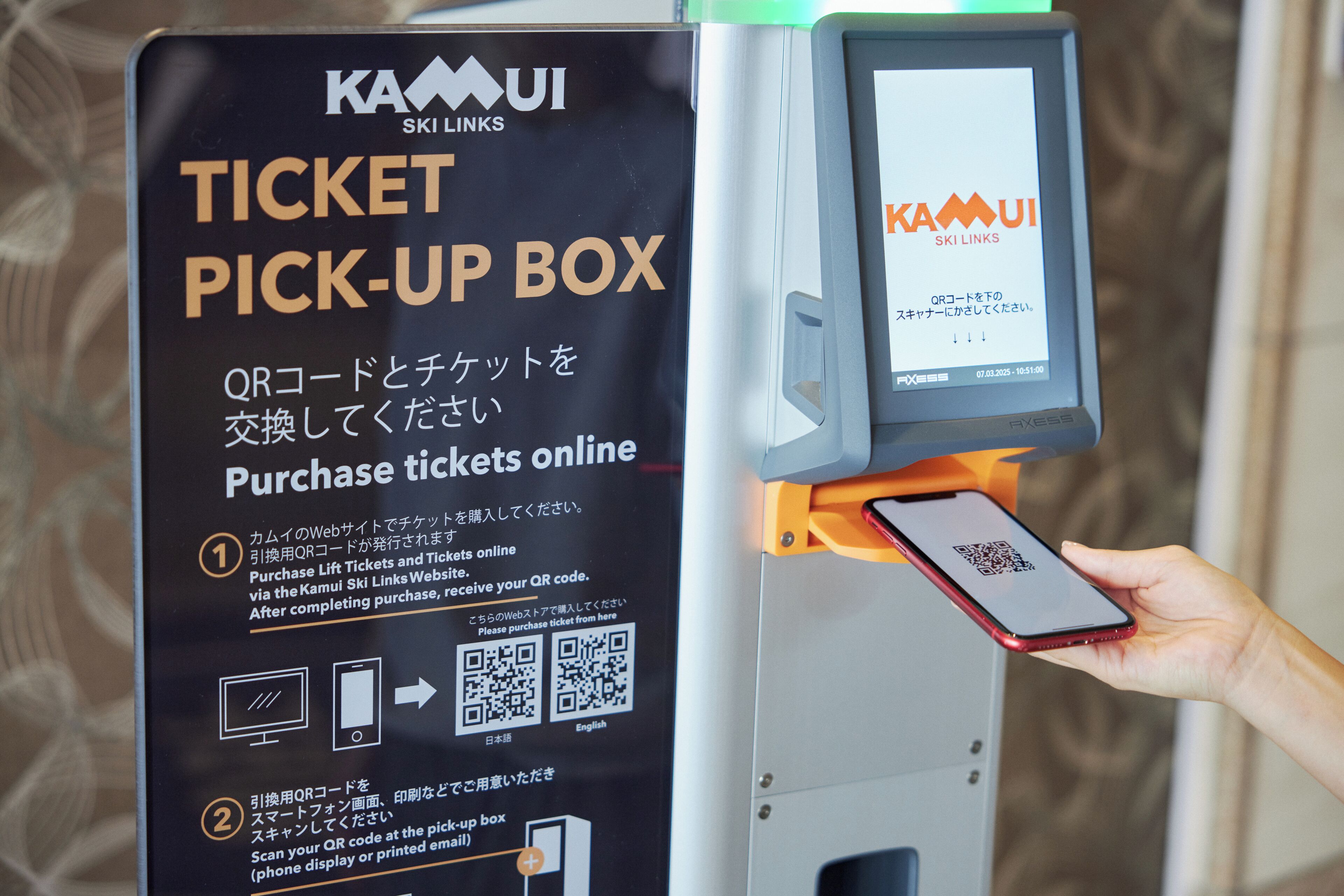 A ticket pick-up box with instructions for purchasing tickets online.