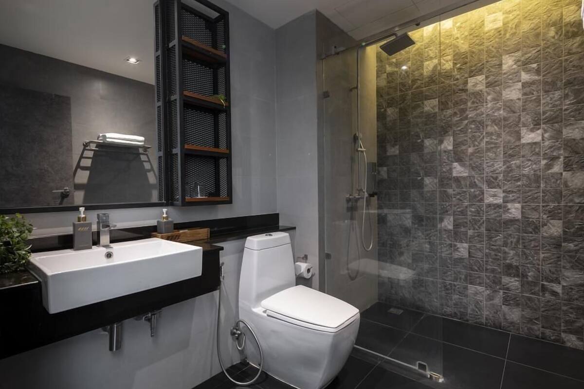 family double room | bathroom | shower, free toiletries, bathrobes, slippers