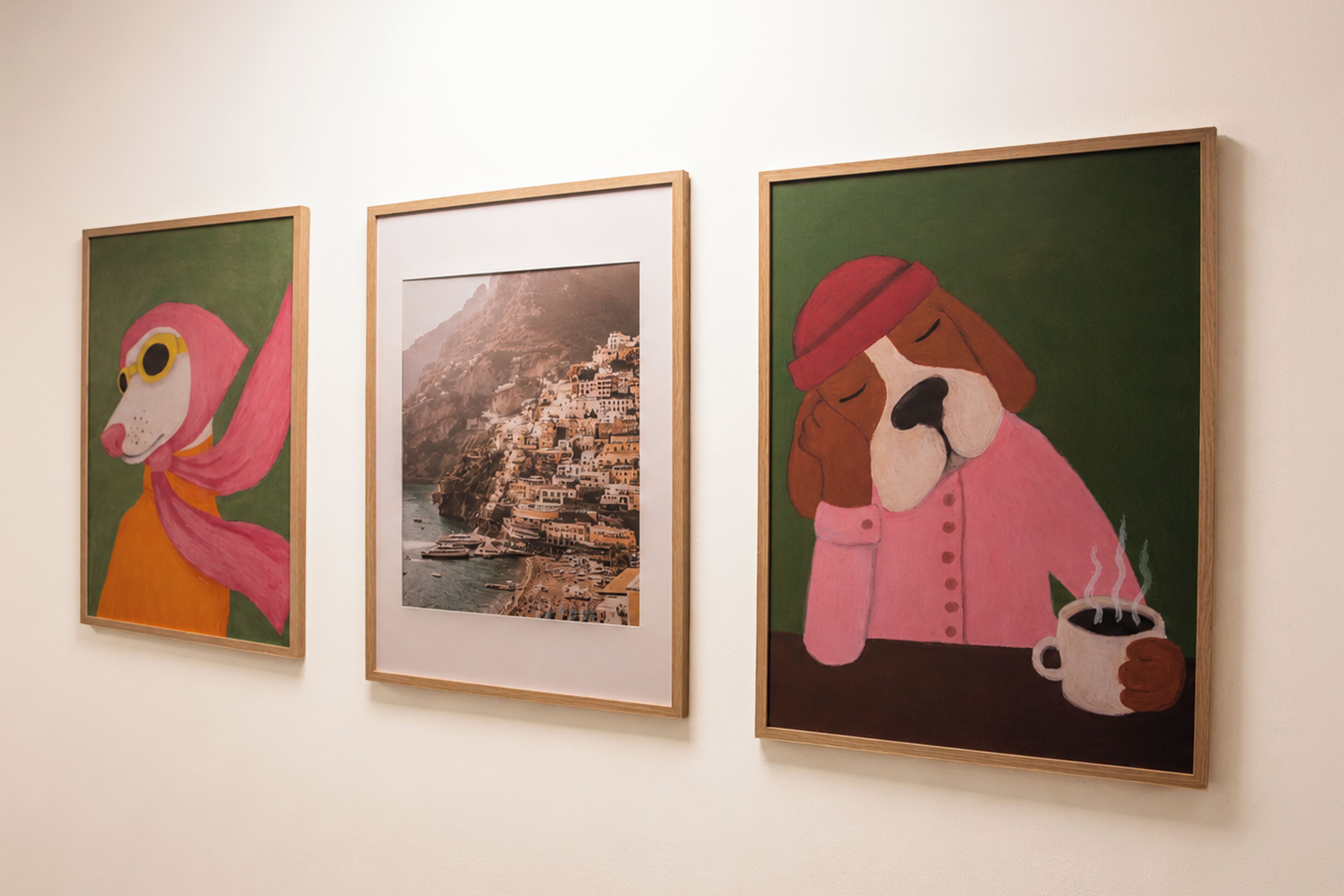 Three framed artworks on a wall.