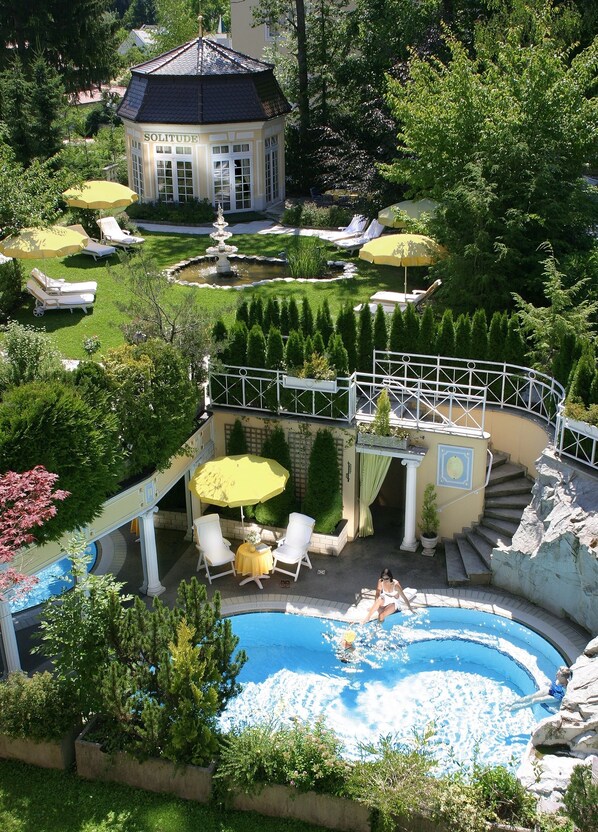 Indoor pool, outdoor pool, pool umbrellas, pool loungers