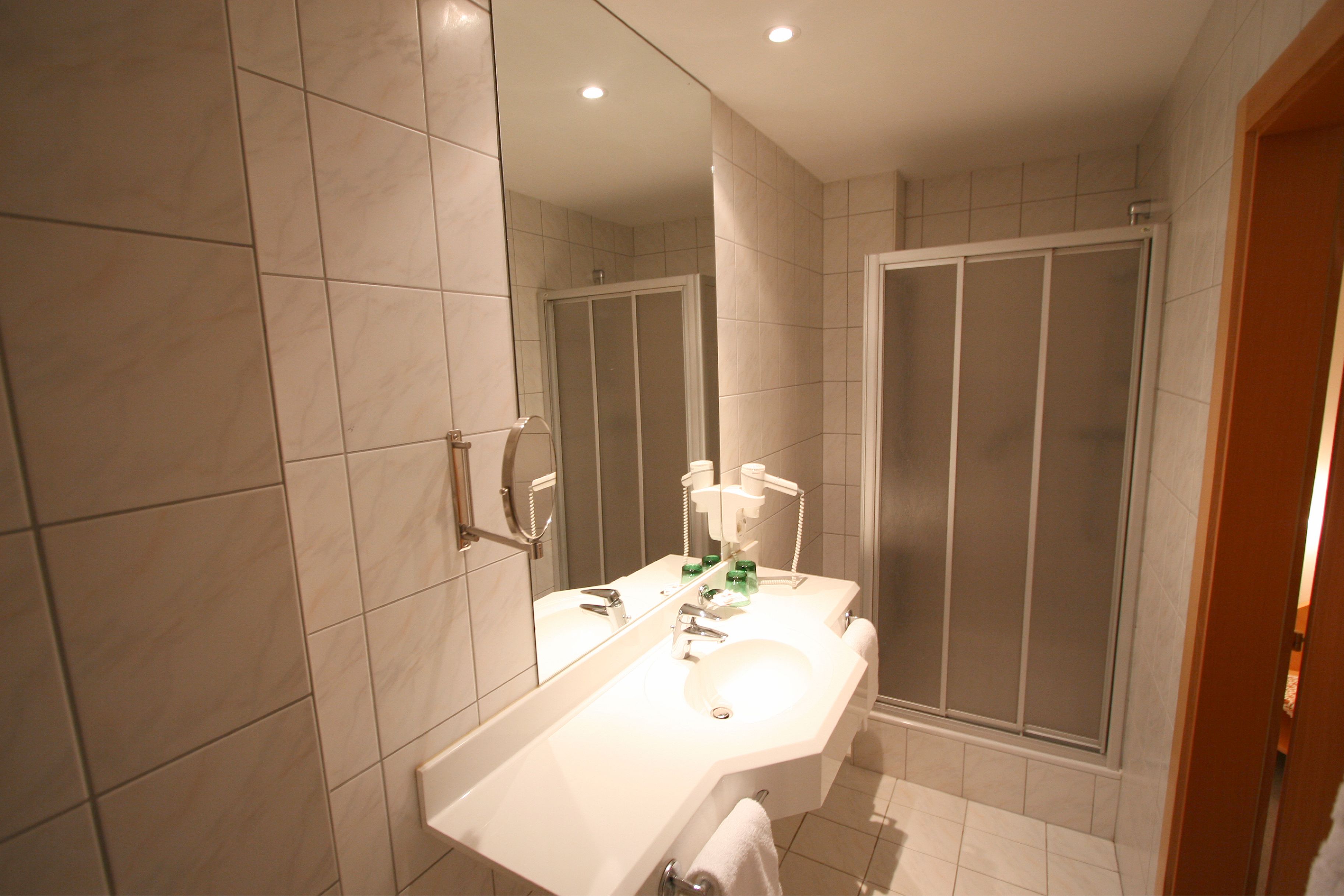 deep-soaking bathtub, eco-friendly toiletries, hair dryer, towels