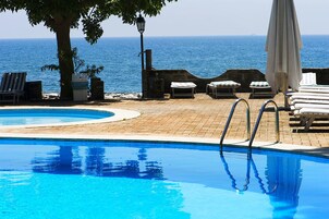 Seasonal outdoor pool, open 8:30 AM to 6:00 PM, sun loungers