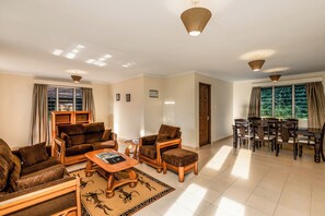 Classic Cottage | Living area | 42-inch flat-screen TV with satellite channels - Chobe Safari Lodge | East Africa Uganda (Karuma)