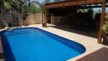 Outdoor pool, pool umbrellas, pool loungers