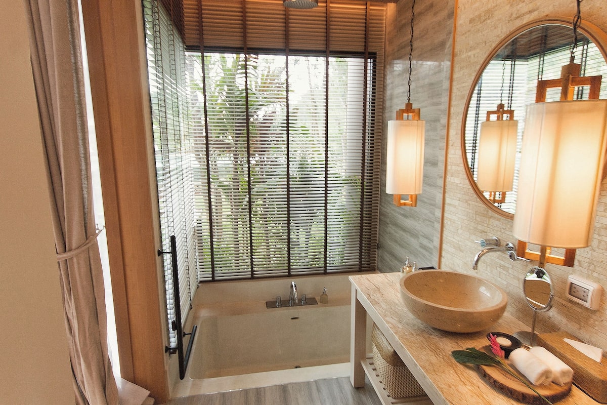 separate bathtub and shower, deep-soaking bathtub, rainfall showerhead