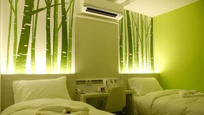 A hotel room with two beds, a desk, and an air conditioning unit. - City Edge Hotel (Kuala Lumpur)