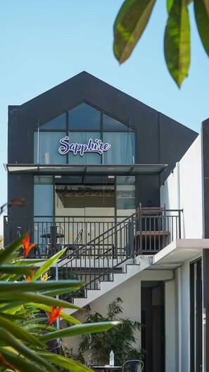 A modern building with a sign reading 'Sapphire' above the entrance. - Front One Hotel Purwodadi (Purwodadi)