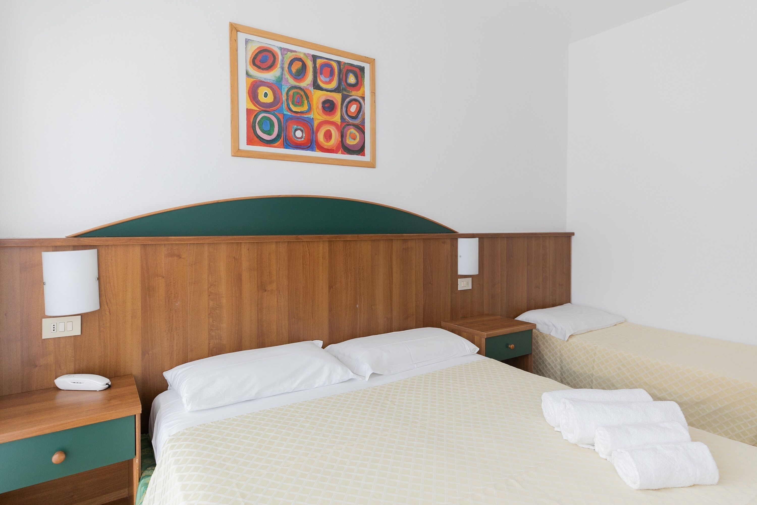 economy triple room, balcony | premium bedding, in-room safe, desk, free wifi