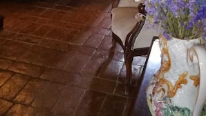 A rustic interior with a wooden staircase, a wooden desk, and a chair. - La Mulattiera (Scarlino)