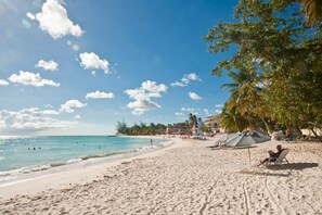 White sand, sun-loungers, beach umbrellas - Terraces Condos at St. Lawrence Gap (St. Lawrence Gap)