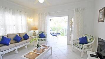 Condo, 2 Bedrooms | Living room | Flat-screen TV