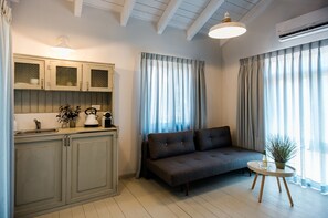 Cabin (Bustan) | Living area | Flat-screen TV - Ein Zivan Tourism (Ein Zivan)