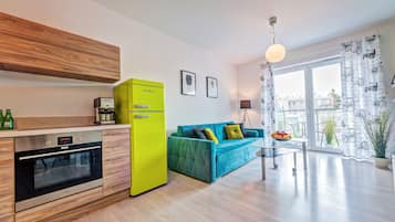 Apartment (Rainbow) | Living room | 50-inch flat-screen TV with cable channels, TV