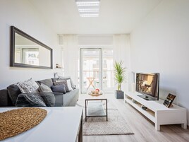 50-inch flat-screen TV with cable channels, TV