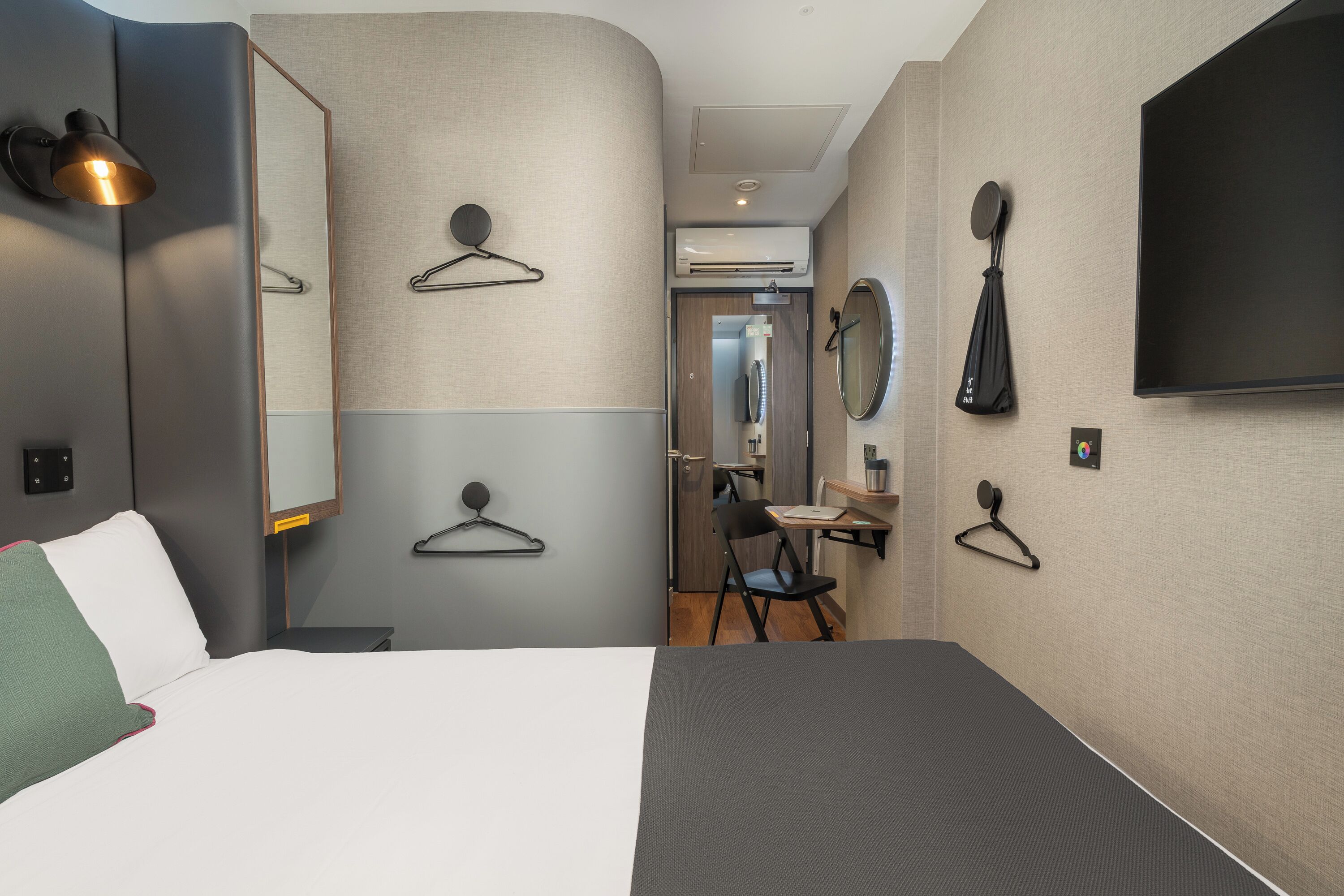 standard double room, no windows | in-room safe, desk, laptop workspace, blackout curtains