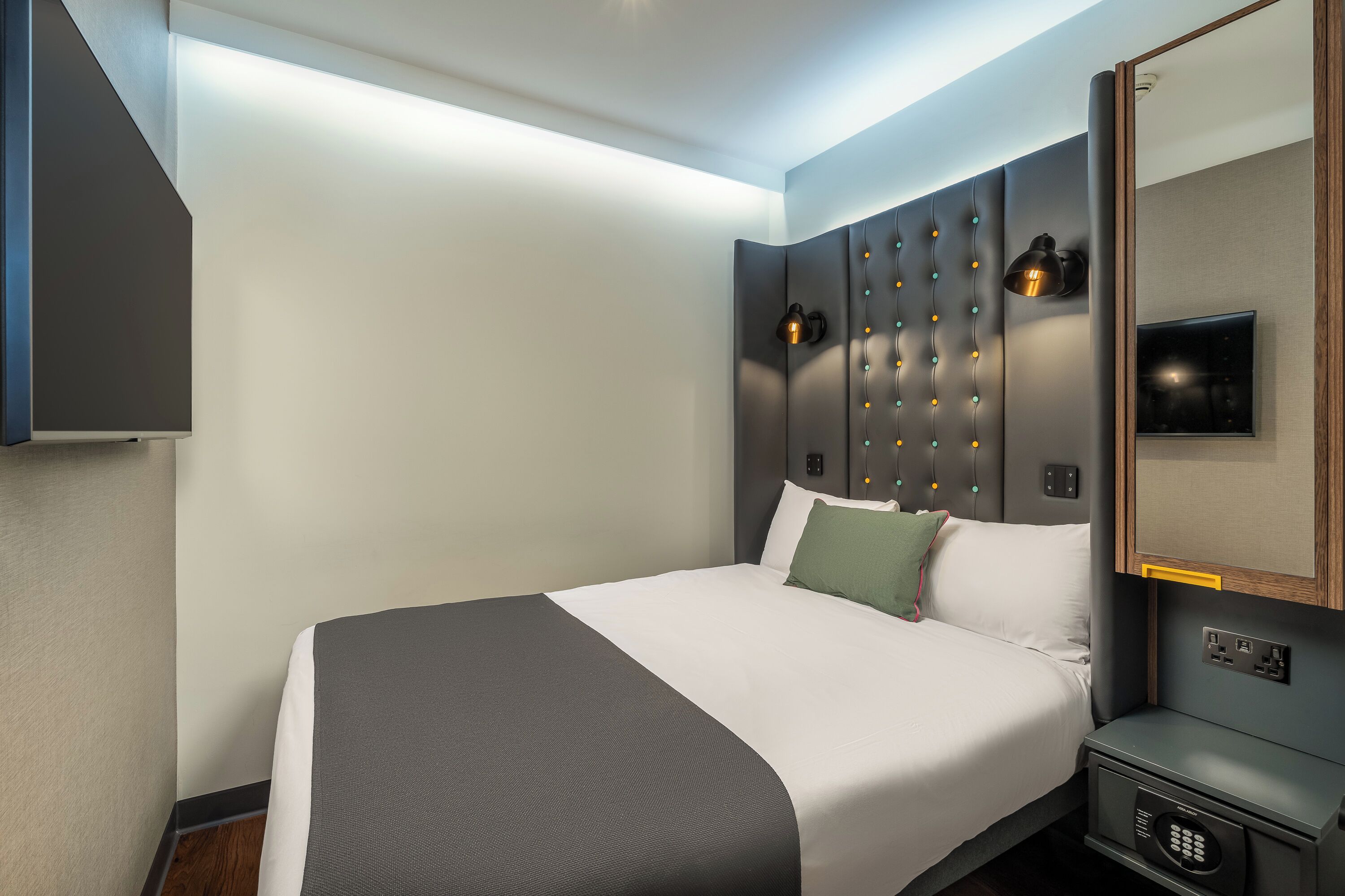 standard double room, no windows | in-room safe, desk, laptop workspace, blackout curtains