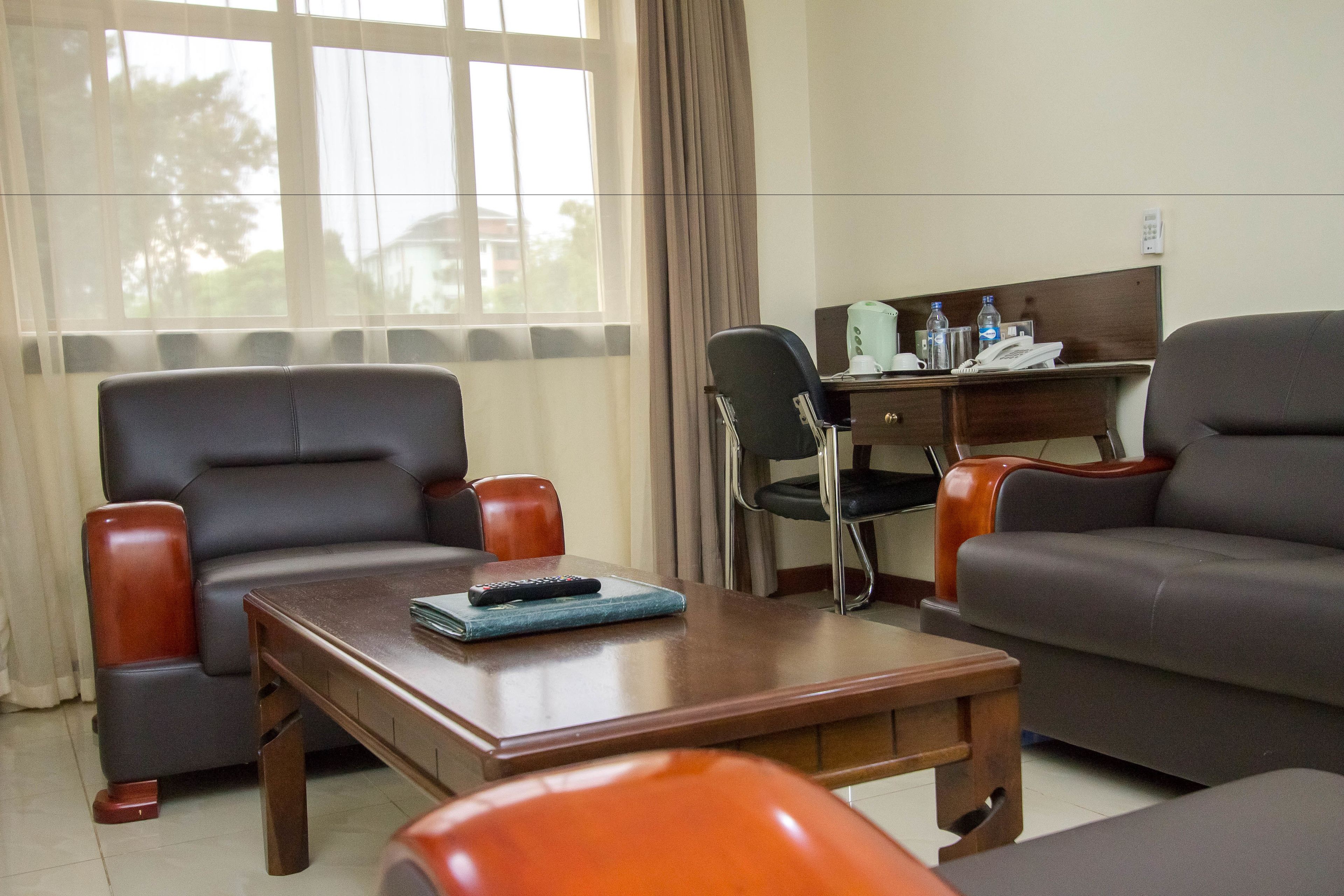 superior double room | living area | tv