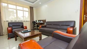 Superior Double Room | Living area | TV