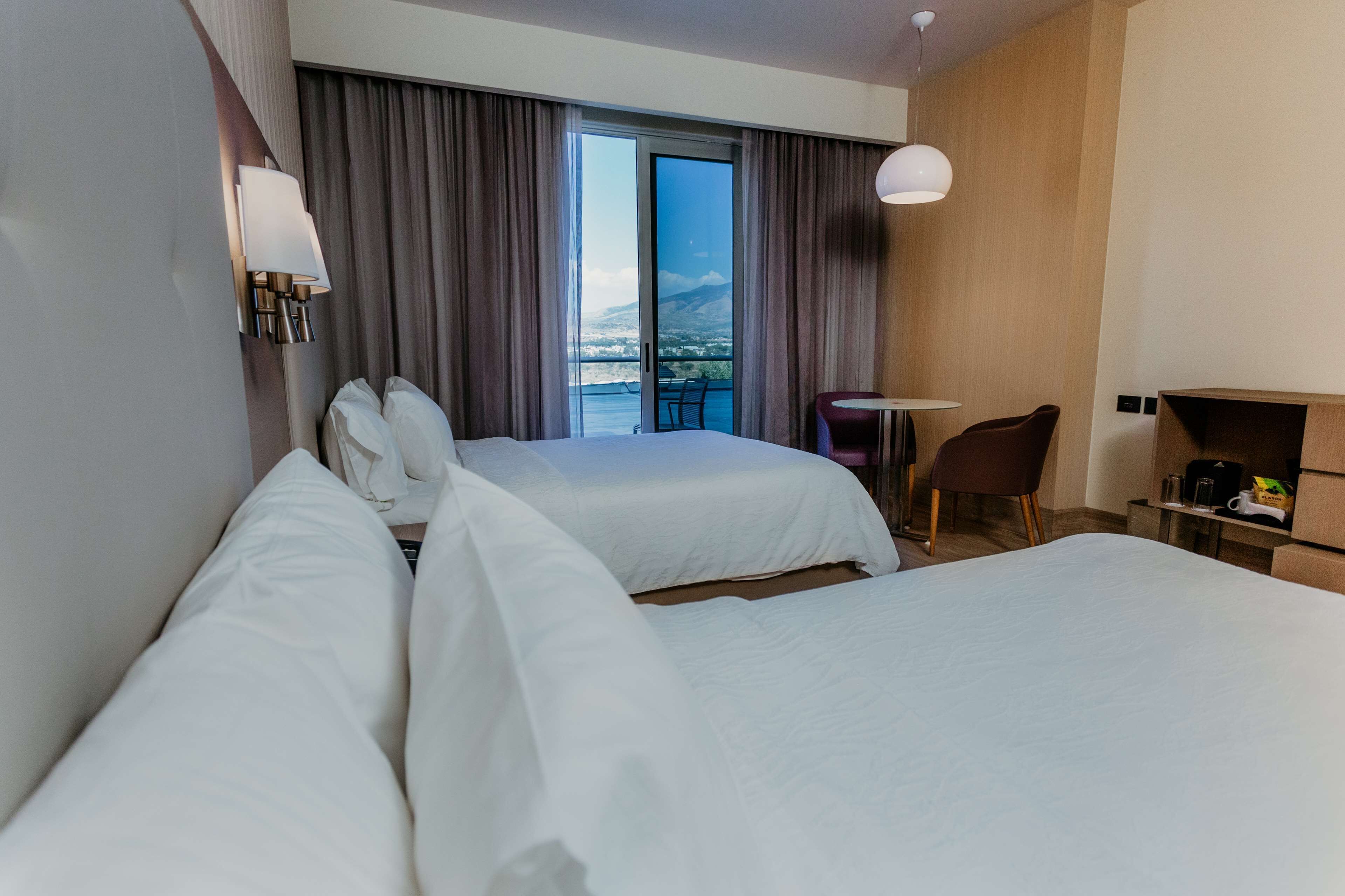 room, 2 double beds, balcony | premium bedding, in-room safe, iron/ironing board, free cots/infant beds