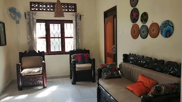 Flat-screen TV, video-game console, DVD player, toys
