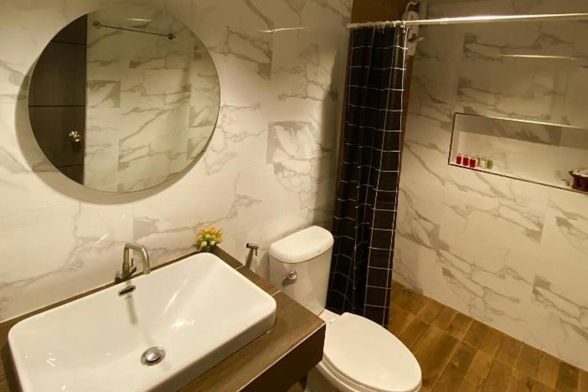family room, private bathroom | bathroom | shower, free toiletries, towels