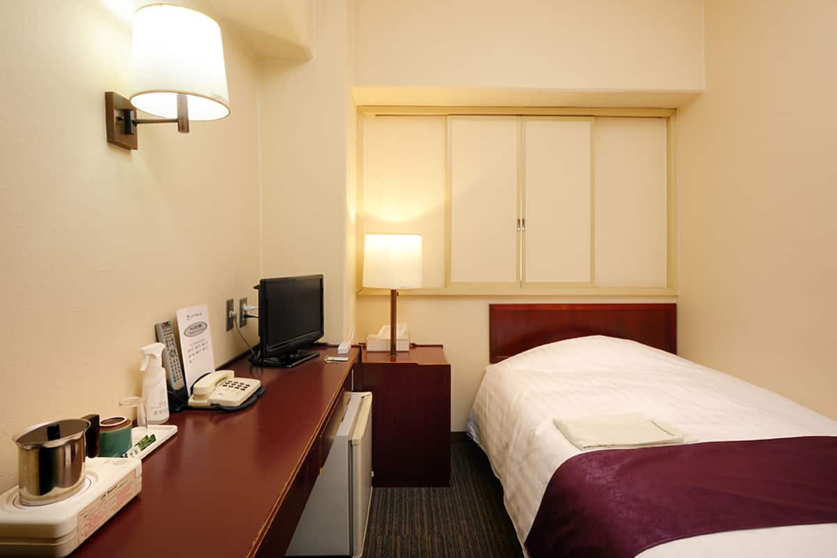 Desk, laptop workspace, free WiFi, bed sheets