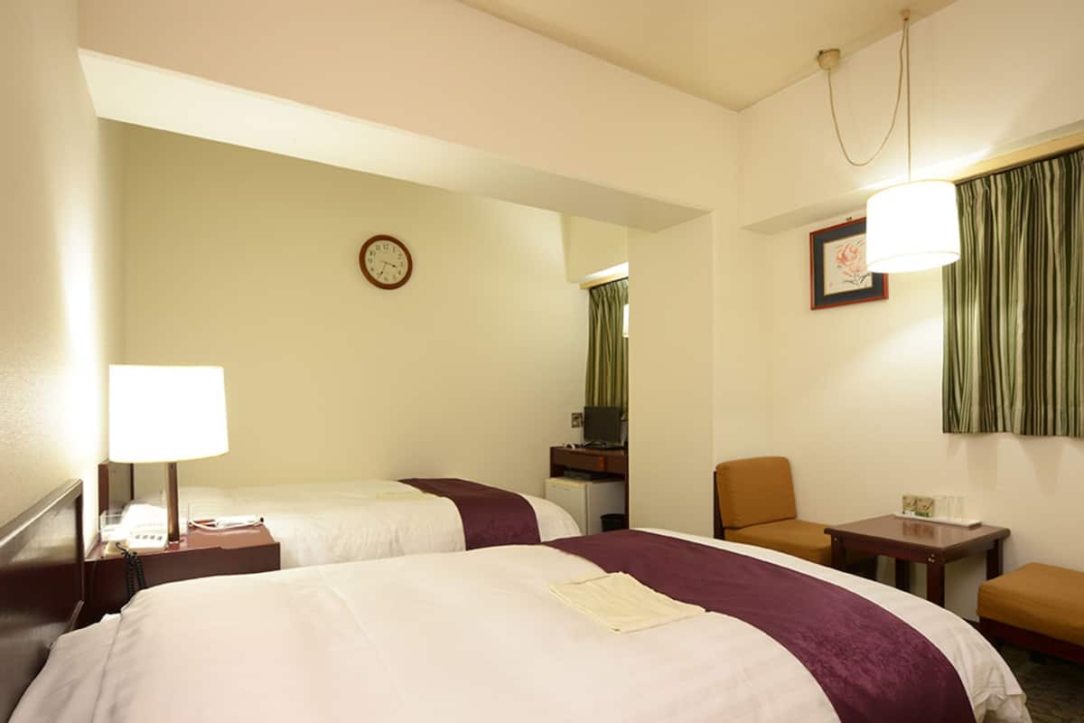 Desk, laptop workspace, free WiFi, bed sheets