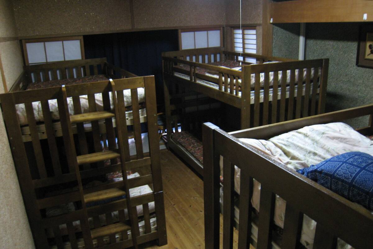 Dormitory for Women | Desk, laptop workspace, bed sheets