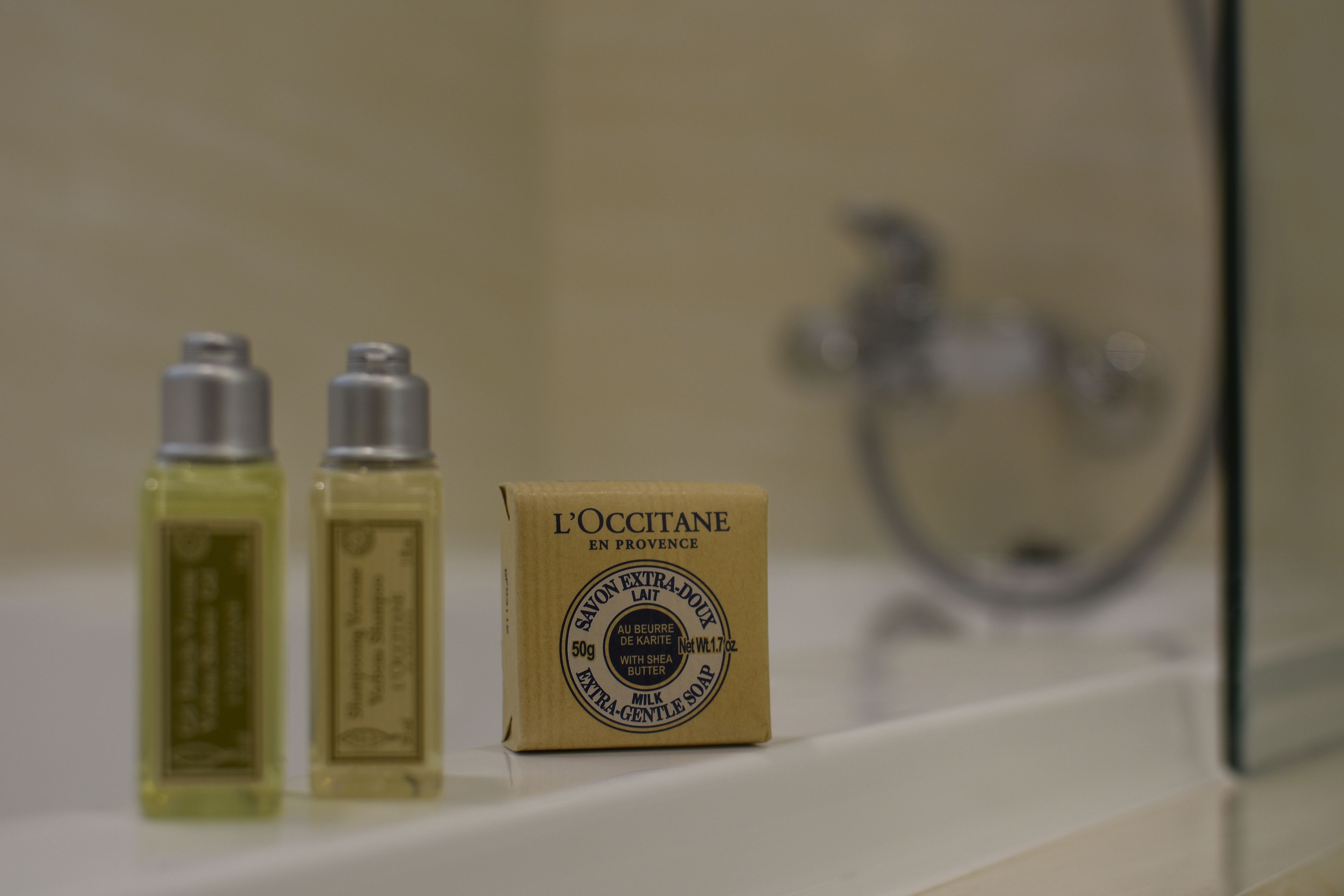 deluxe view king room | bathroom | designer toiletries, hair dryer, slippers, towels