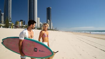 Beach nearby, white sand, beach umbrellas, beach towels