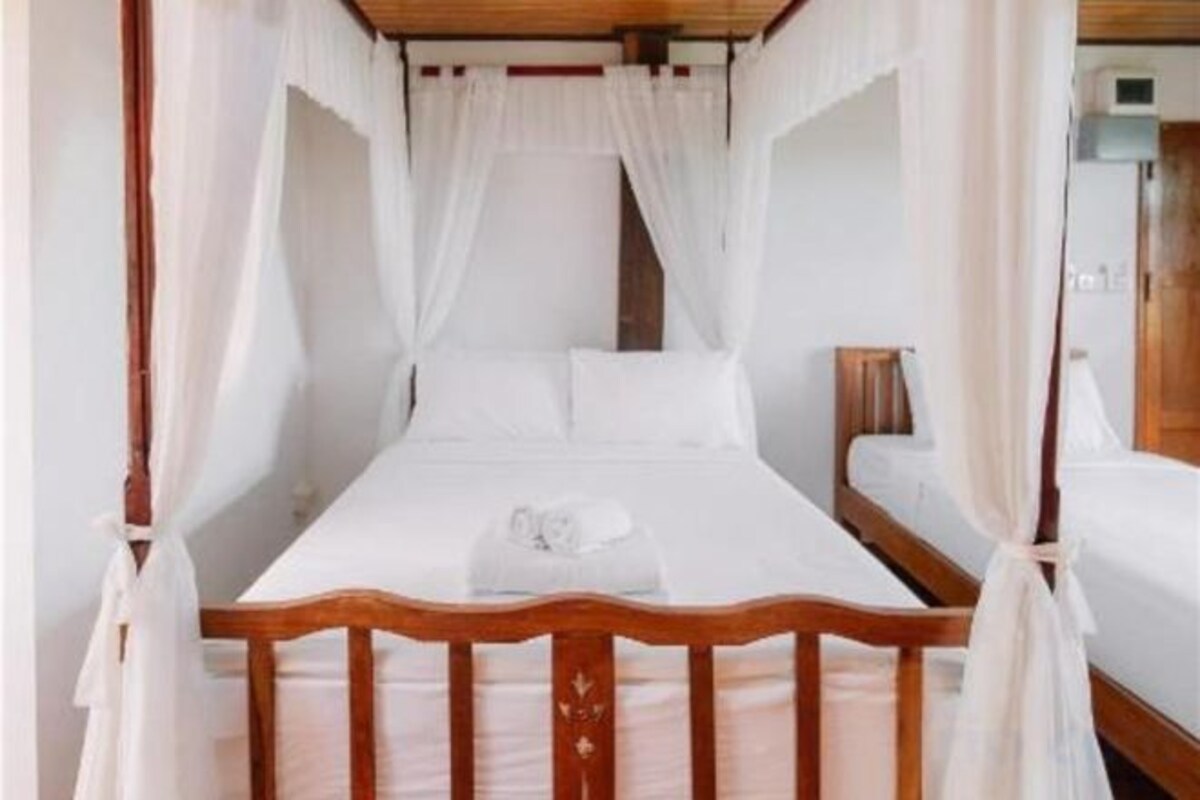 Desk, blackout drapes, rollaway beds (surcharge), WiFi (free)