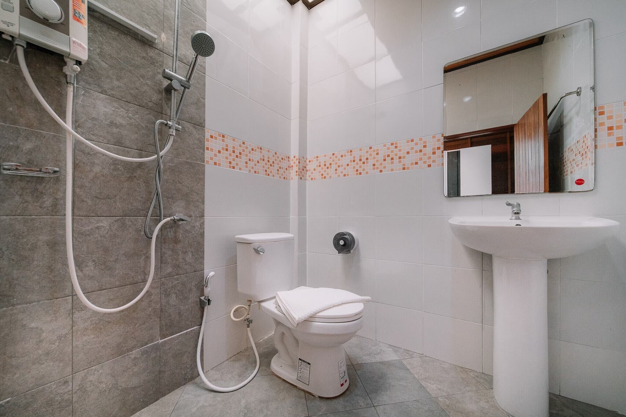 superior triple room with garden view | bathroom | shower, free toiletries, hair dryer, slippers