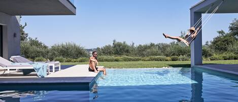 Outdoor pool, pool umbrellas, pool loungers
