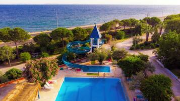 Indoor pool, outdoor pool, pool umbrellas, pool loungers