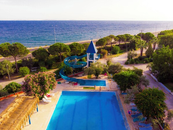 Indoor pool, outdoor pool, pool umbrellas, pool loungers