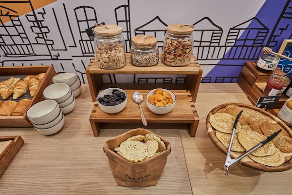 Daily buffet breakfast (EUR 14 per person)