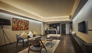 Premier Suite, 2 Twin Beds | Living area | LED TV, fireplace - Tropics Eight Suites (George Town)