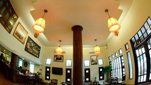 A lobby with a high ceiling, large windows, and multiple chandeliers. - Swankaburi Boutique Hotel (Sawankhalok)