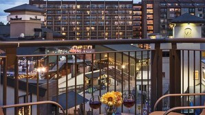 A hotel with a glass-enclosed balcony, a clock tower, and a view of the surrounding buildings. - Mount Yale 611 4 BedroomCondo By Moving Mountains (Steamboat Springs)